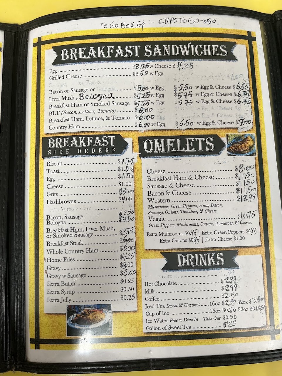 Printed diner menu with breakfast and lunch items.
